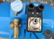 What is the purpose of installing a water pressure switch for a borehole pump and how it works